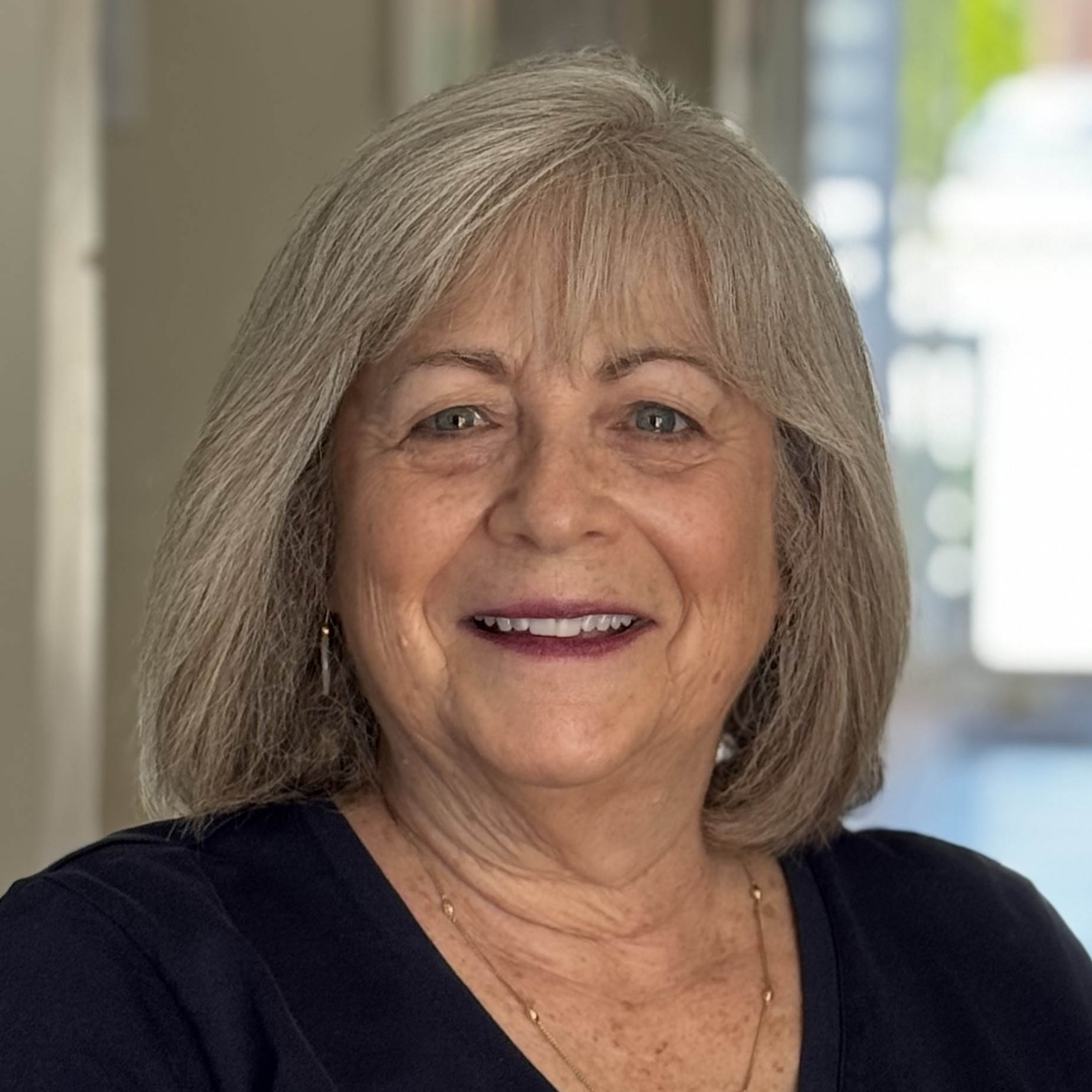 Headshot portrait of Silver Lining Mentoring volunteer mentor Betsy Kassler